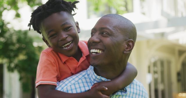 Smiling African American Father and Son Enjoying Time Outdoors - Download Free Stock Images Pikwizard.com