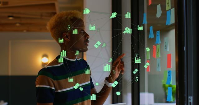 Focused Professional Analyzing Data with Virtual Graphic Overlay - Download Free Stock Images Pikwizard.com