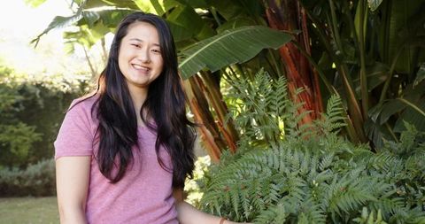 Woman Enjoying Lush Tropical Garden Outdoor Serenity