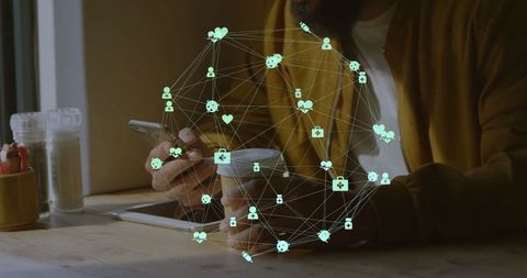 Man Managing Digital Health Data in Cafe Setting