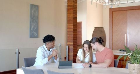 Diverse team collaborating in modern office with document review