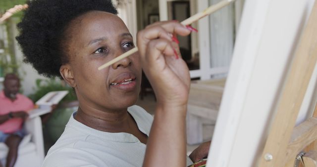 Woman Enjoying Outdoor Painting Session on Canvas - Download Free Stock Images Pikwizard.com