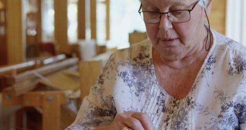 Senior Woman Engaged in Crafting at Home