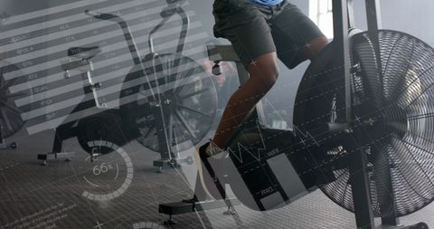 Man Training on Elliptical with Fitness Data Interface