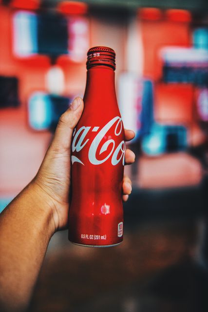 Perfect for illustrating concepts of refreshment and well-known branding. Useful in advertisements promoting soda beverages, articles discussing the popularity of iconic brands, or marketing materials for summer events.