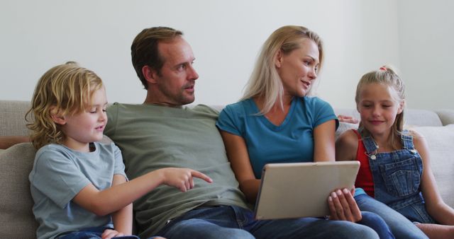 Happy Family Relaxing with Tablet on Couch at Home - Download Free Stock Images Pikwizard.com