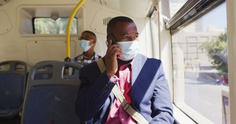 Man in Bus Wearing Mask and Using Smartphone for Communication - Download Free Stock Images Pikwizard.com
