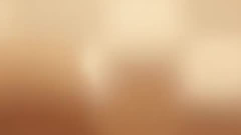 Warm cinematic camera glide capturing soft bokeh glow and golden gradient light motion