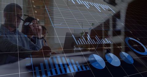 Team analyzing digital dashboards with blue data visualizations overlaying boardroom