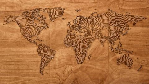 Engraved World Map on Wooden Surface Rustic Interior Décor
