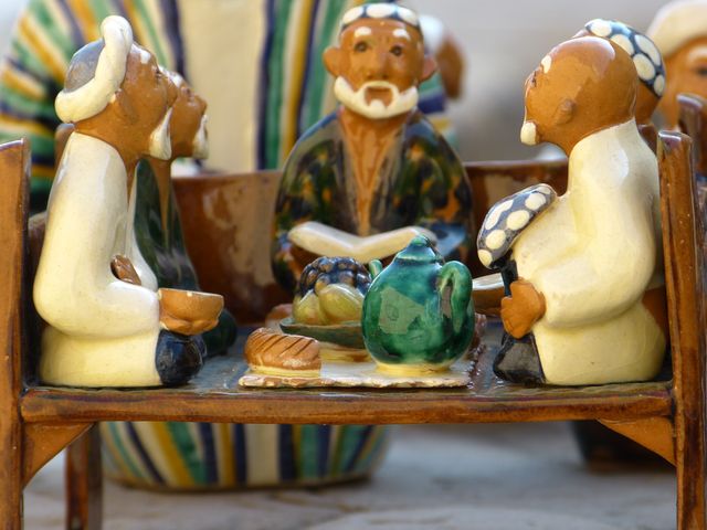 Clay Figurines Depict Traditional Gathering With Tea and Bread - Download Free Stock Images Pikwizard.com