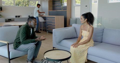 Family Spending Quality Time Together in Modern Living Room