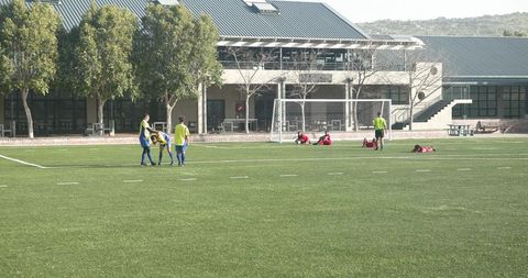 Youth soccer practice on afternoon field fostering teamwork