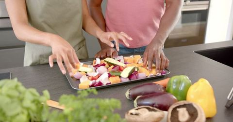 Couple Preparing Vegetables Together for Baking at Home