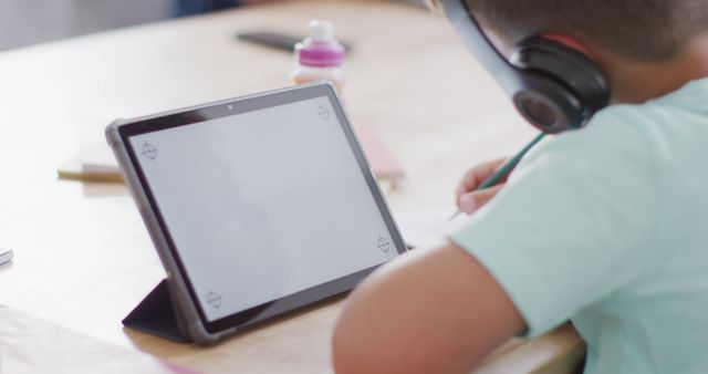 Child Using Tablet for Remote Learning at Home - Download Free Stock Images Pikwizard.com