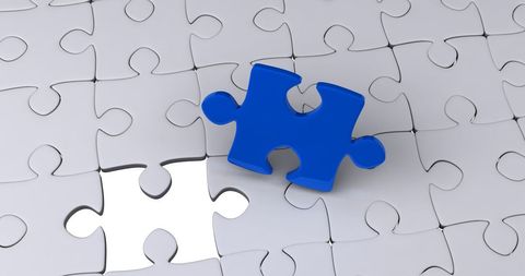 Blue Puzzle Piece Fitting into Gray Puzzle Surface - Download Free Stock Images Pikwizard.com