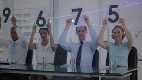 Diverse Business Team Holding Number Scorecards in Office