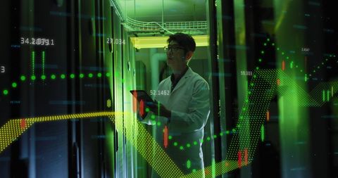 Asian IT Technician Analyzing Financial Data in Server Room - Download Free Stock Images Pikwizard.com