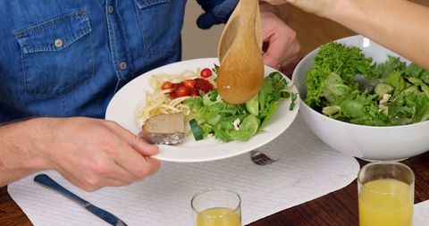 Sharing Delicious Homemade Meal at Family Dinner Table - Download Free Stock Images Pikwizard.com