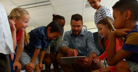 engaged students learning with teacher using digital tablet - Download Free Stock Images Pikwizard.com