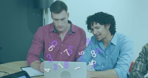 Colleagues Collaborating on Data Processing Project