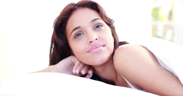 Tranquil Young Woman Relaxing in Bed with Soft Lighting - Download Free Stock Images Pikwizard.com