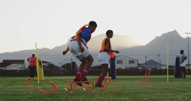 Young Athletes Training at Rugby Field with Mountain View - Download Free Stock Images Pikwizard.com