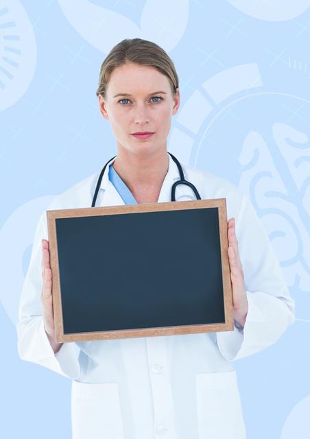 This image features a doctor holding a blank slate board against a blue medical-themed background. Ideal for use in healthcare presentations, medical websites, hospital brochures, and educational materials. The blank slate provides space for adding custom messages, medical information, or promotional content.