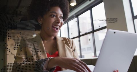 Finance Data Overlay with Excited Businesswoman Using Laptop