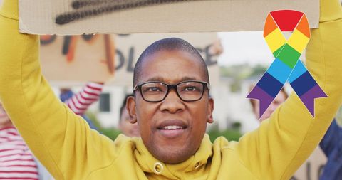 Protester advocating lgbt rights and equality holding banner
