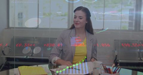 Businesswoman Analyzing Data with Digital Analytics Interface