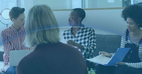 Diverse Office Team Collaborating in Modern Lounge