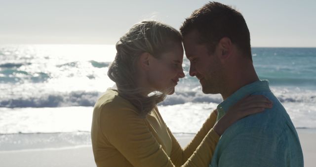 Romantic Couple Embracing on Beach During Sunset - Download Free Stock Images Pikwizard.com