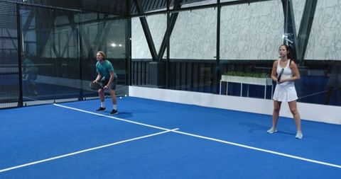 Young Athletic Teammates on Padel Court in Modern Sports Hall