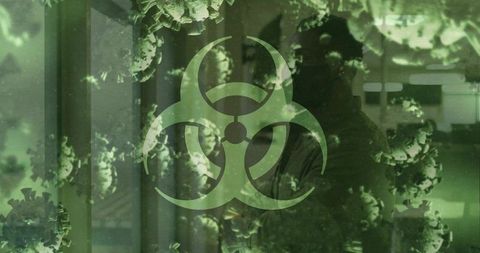 Biohazard symbol overlaying virus particles in green laboratory corridor warning