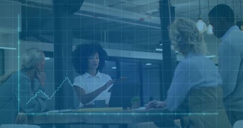 Business Team Analyzing Data on Laptop in Modern Office Setting