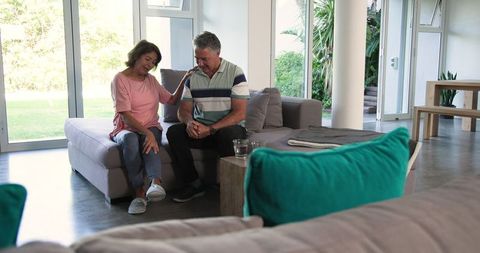 Senior Couple Relaxing at Home Sharing a Light Moment