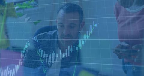 Business professionals analyzing digital financial graph with tablets