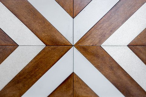 Geometric wooden and metallic tile pattern background