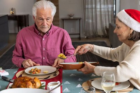 Senior Couple Enjoying Festive Holiday Meal Together