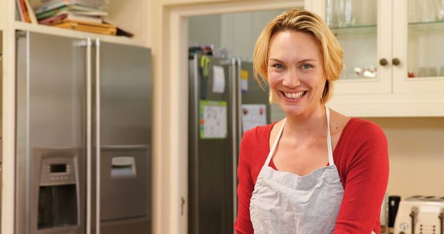 Smiling Woman in Kitchen with Apron - Download Free Stock Images Pikwizard.com