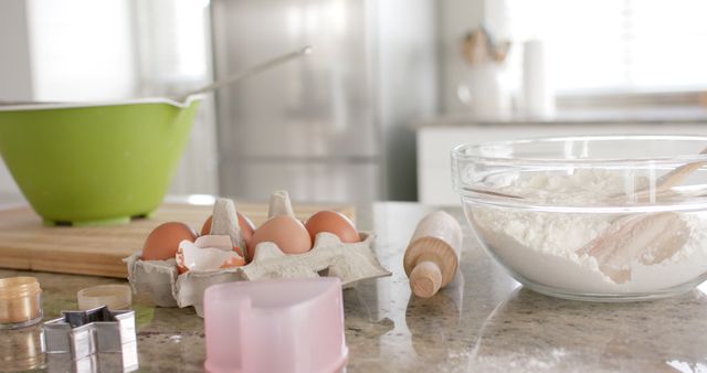 Baking scene in a modern kitchen, perfect for illustrating home-cooking projects, recipe blogs, culinary articles, or advertisements for kitchen equipment and baking ingredients. Setting conveys a peaceful, clean, and organized kitchen environment.