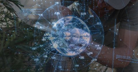 Holographic Globe Projecting Global Data Network Over Workspace with Man Wearing Cap
