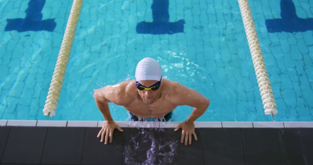 Professional Swimmer Emerging from Pool after Training Session - Download Free Stock Images Pikwizard.com