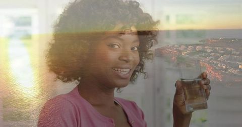 Joyful Woman Enjoys Tranquil Moments with Refreshing Water