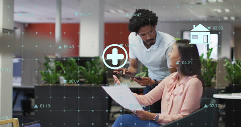 Diverse Coworkers Collaborating with Medical Icons and Data in Office