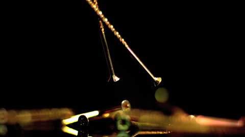 Copper Nails Falling in Slow Motion with Captivating Dynamics