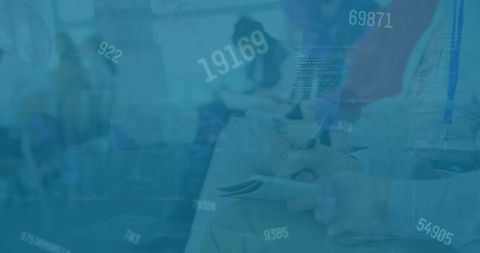 Professional seminar attendee taking notes at conference