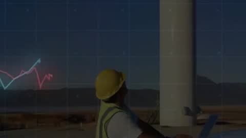 Engineer Using Laptop for Wind Turbine Performance Assessment