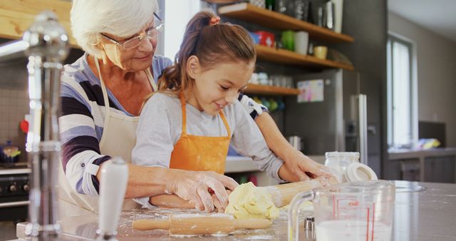 Grandmother and Little Girl Flattening Dough with Rolling Pin in Kitchen - Download Free Stock Images Pikwizard.com